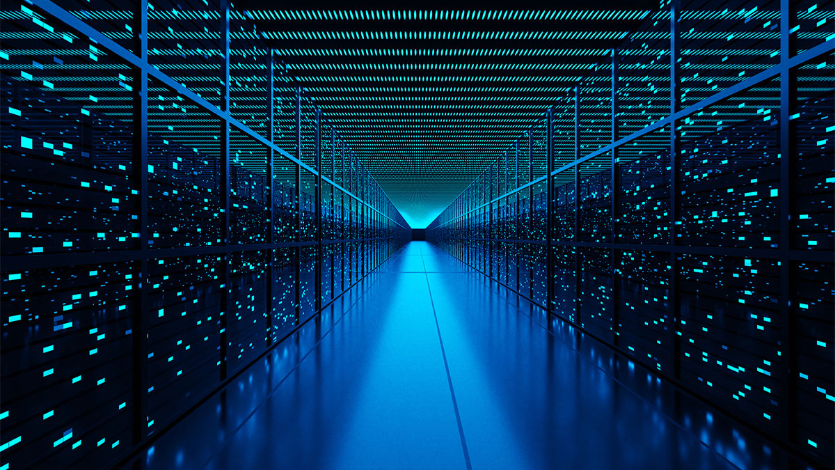 Server racks full of routers, switches and servers aligning on both sides of an aisle of a data center