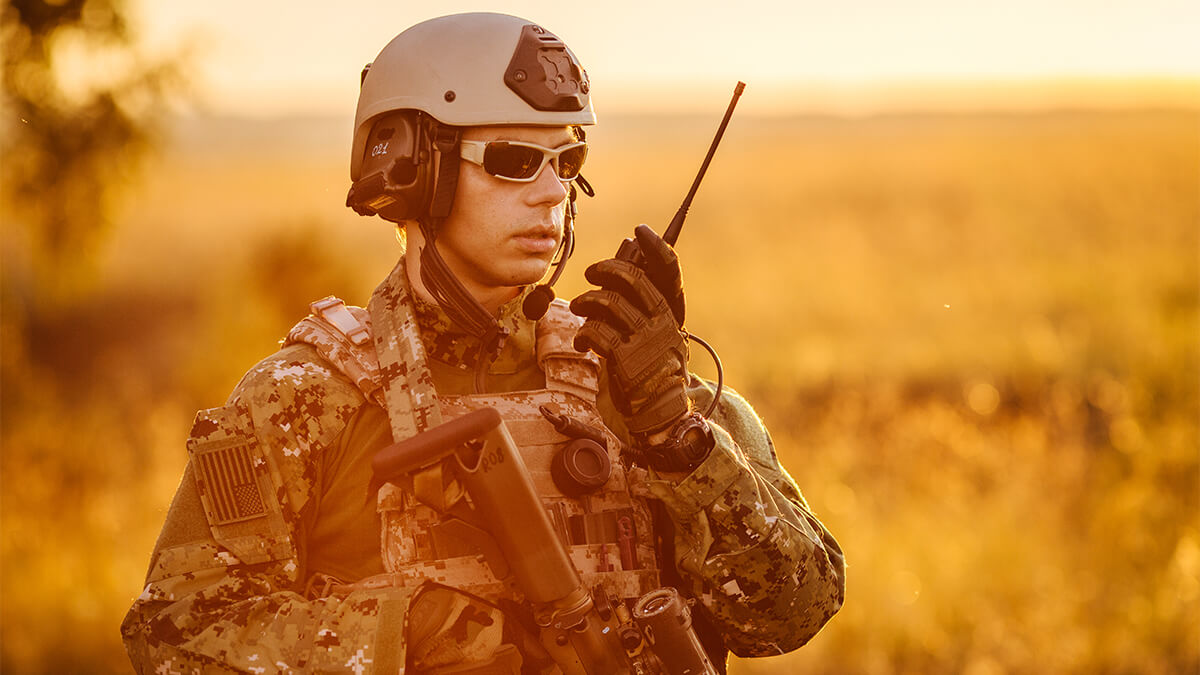 Positioning Navigation and Timing; soldier in the field with radio