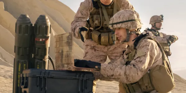 Soldiers are Using Laptop Computer for Surveillance During Military Operation in the Desert