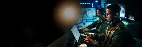 Military control room, computer and soldier at desk, typing code and tech for communication army office.