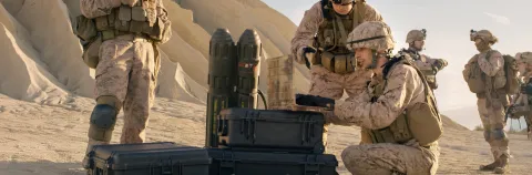 Soldiers are Using Laptop Computer for Surveillance During Military Operation in the Desert