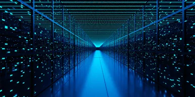 Server racks full of routers, switches and servers aligning on both sides of an aisle of a data center